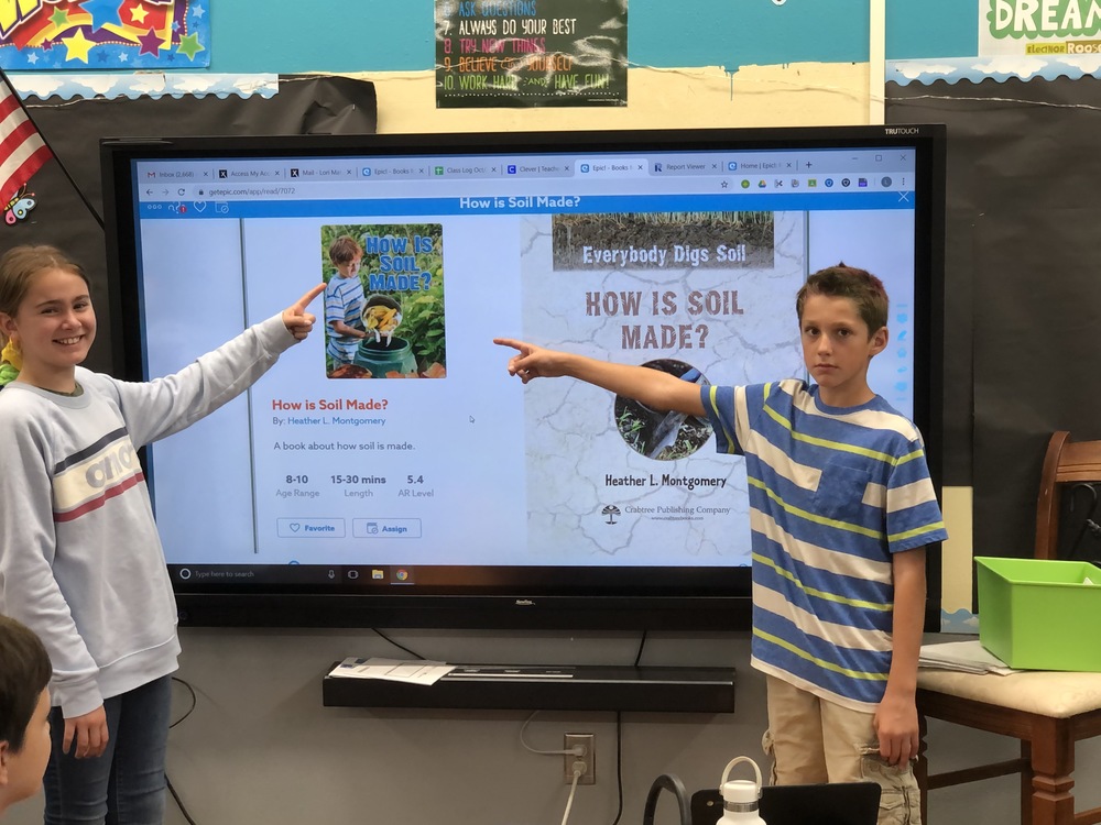 Students Using Interactive Screens