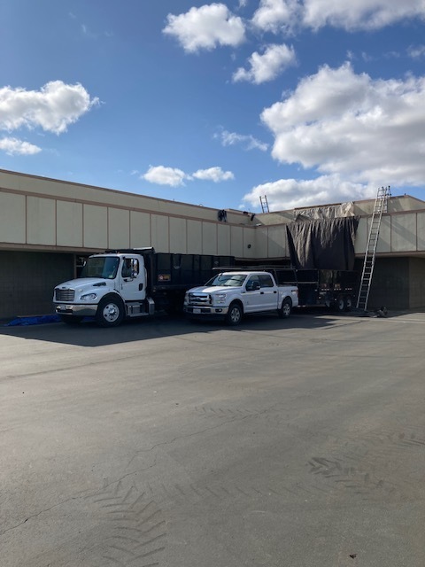 Work trucks at the Wyandotte Roofing project